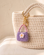 Crochet mini bag charm on a tote bag