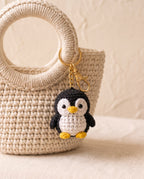 Crochet penguin charm on a tote bag