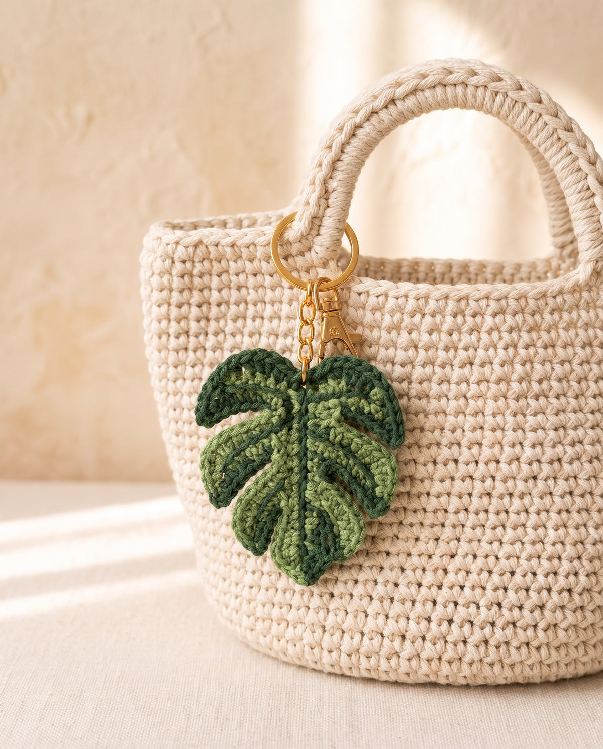Crochet leaf charm on a tote bag