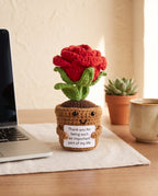 Crochet rose pot desk buddy on an office desk