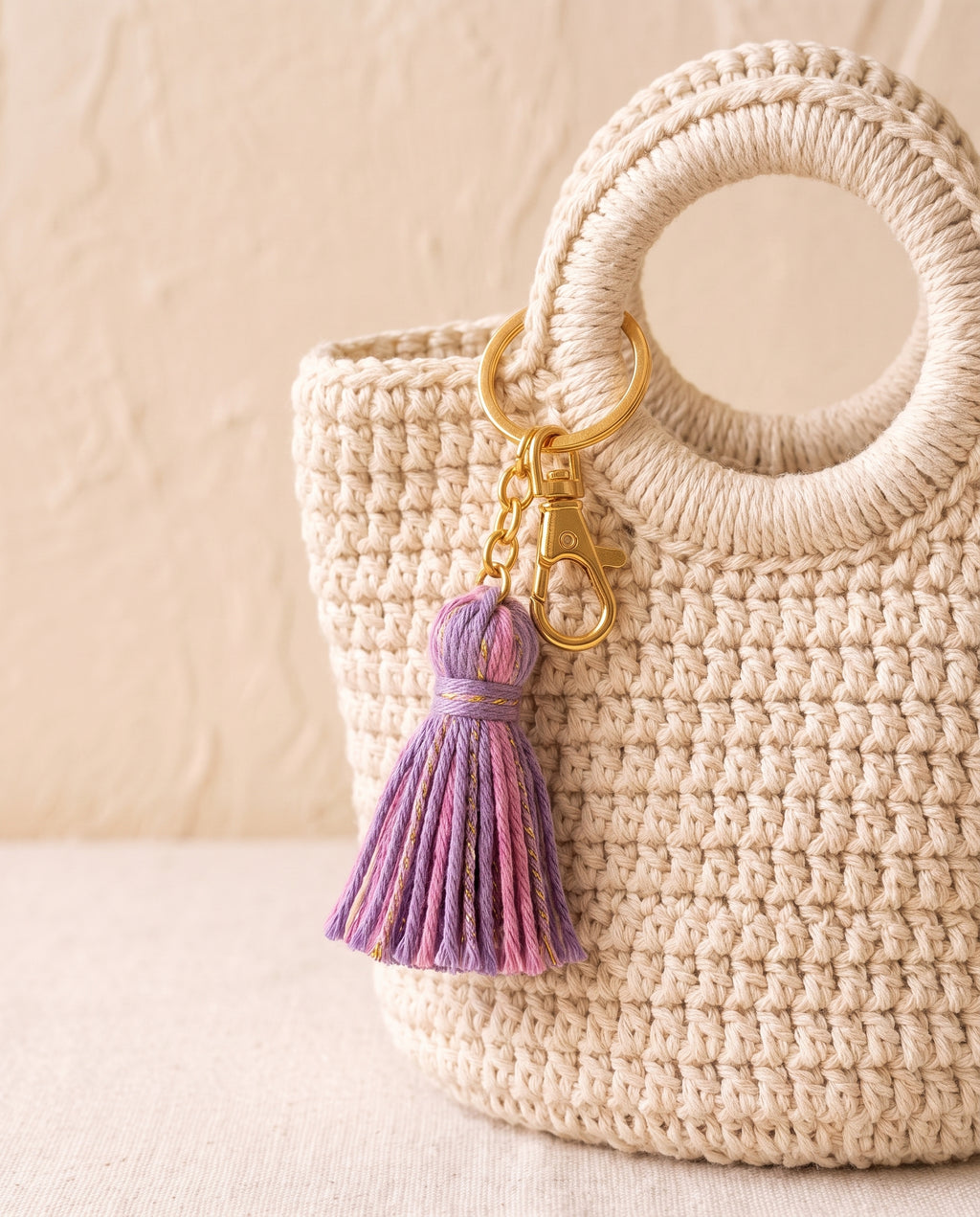 Crochet tassel charm on a tote bag