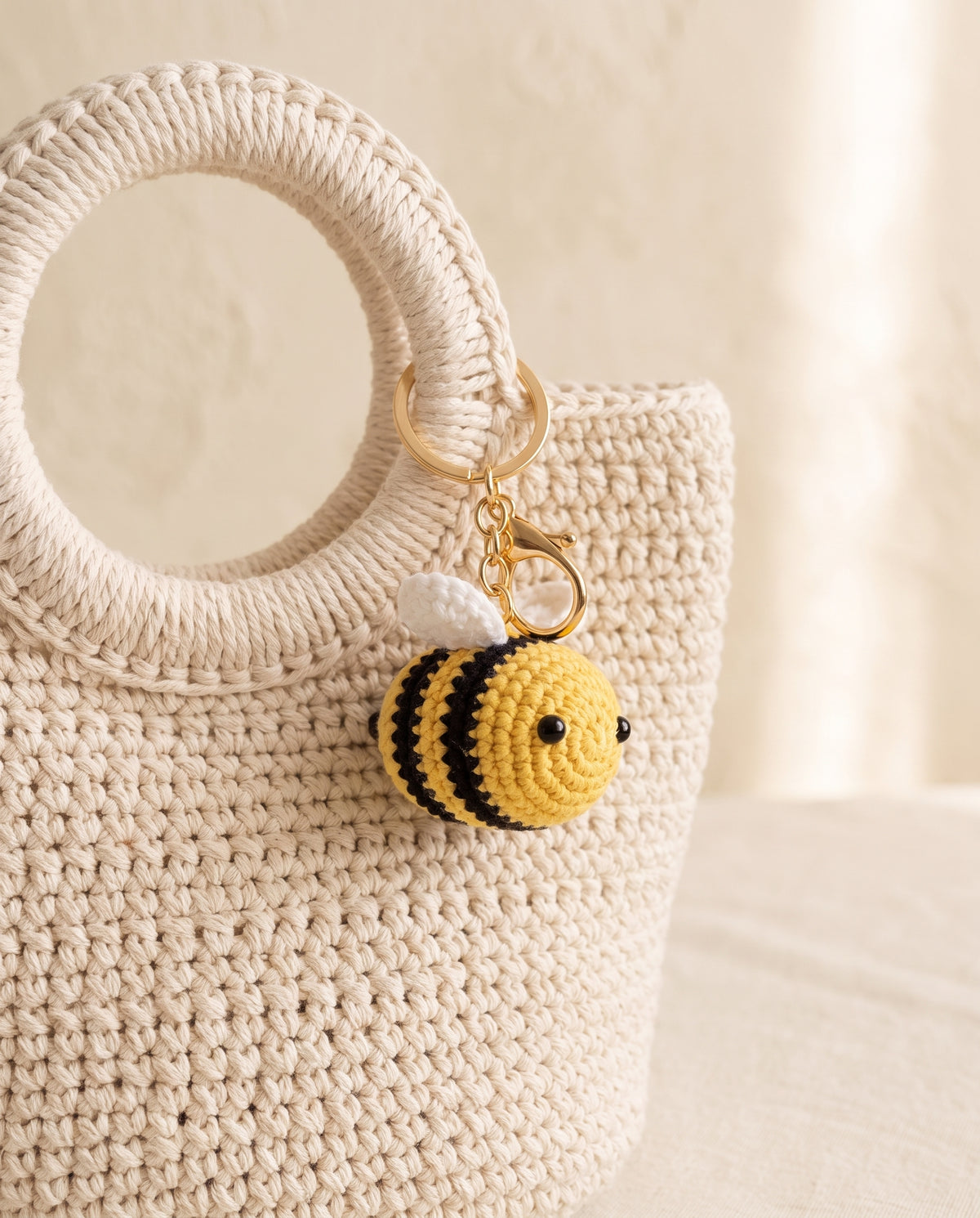 Crochet bee charm on a tote bag