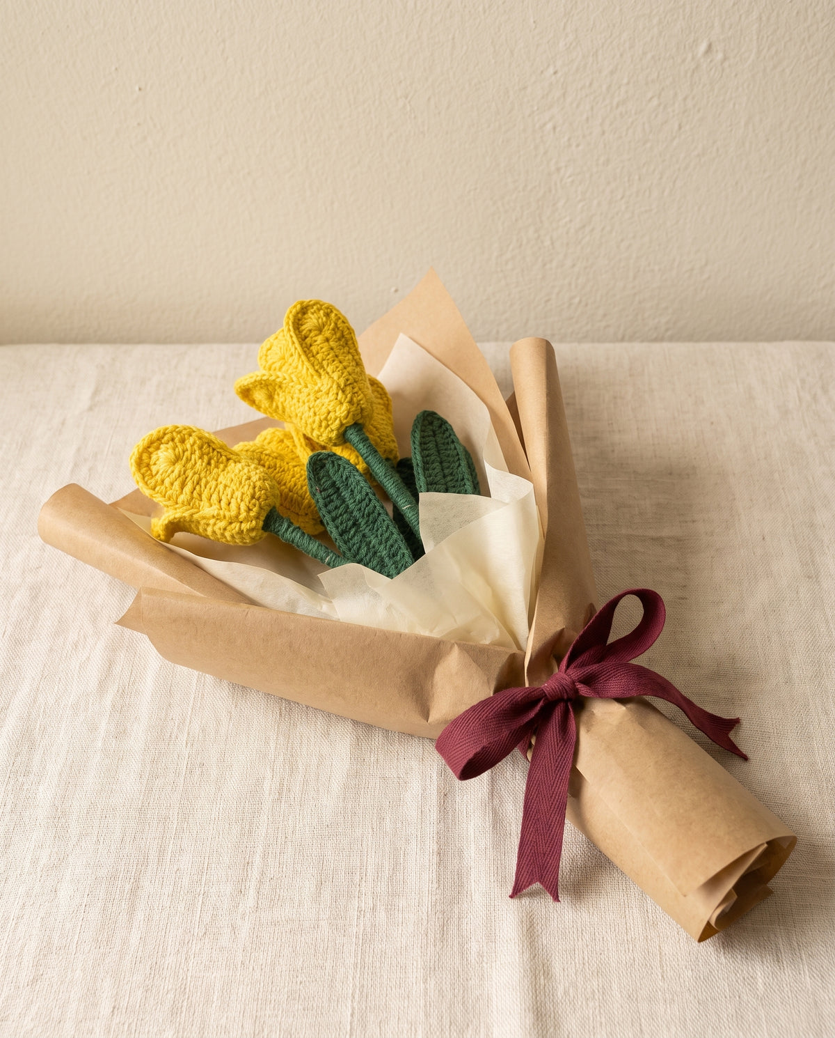 Wrapped bouquet of 3 crochet yellow tulips