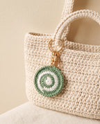 Crochet circle charm on a tote bag