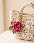 Crochet rose charm on a tote bag