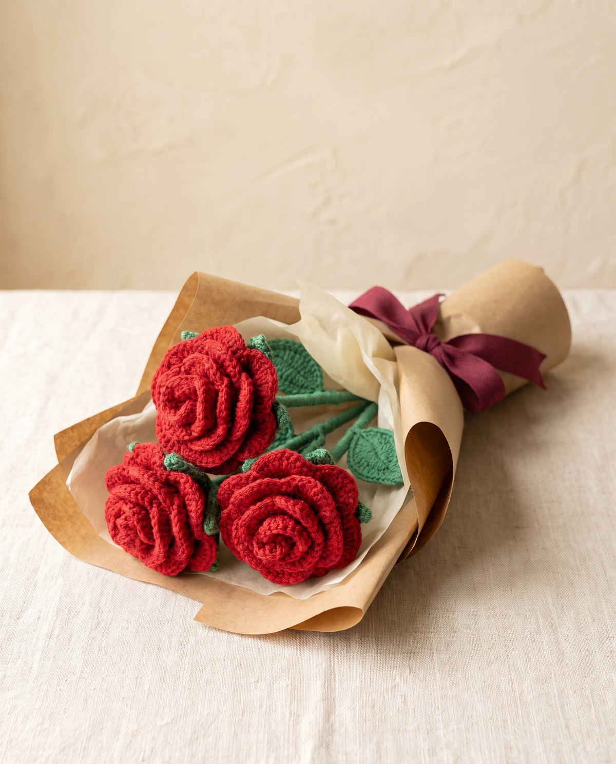 Wrapped bouquet of 3 crochet red roses