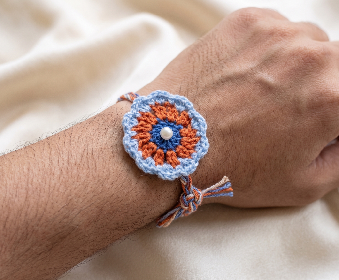 Blue and orange mandala crochet rakhi