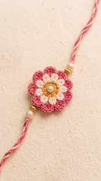Handmade pink ombre layered crochet flower rakhi with pearl and gold beads