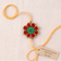 Handmade red green and gold crochet marigold flower rakhi with pearl for Raksha Bandhan