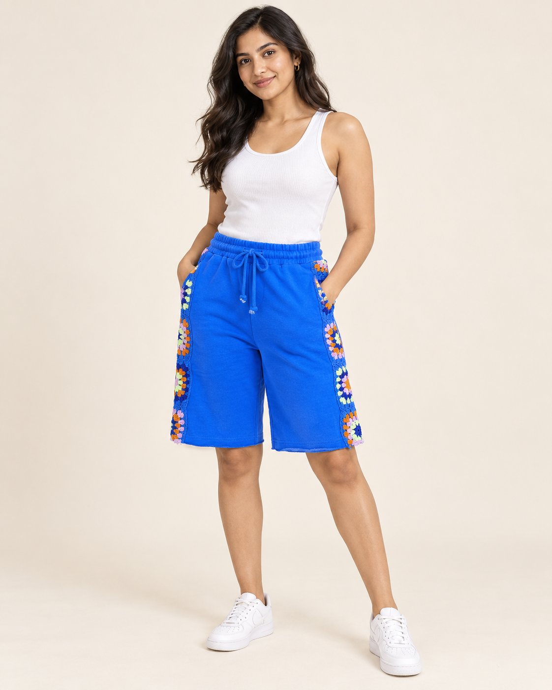 Cobalt blue knee-length Bermuda shorts with hand-crocheted granny square side panels
