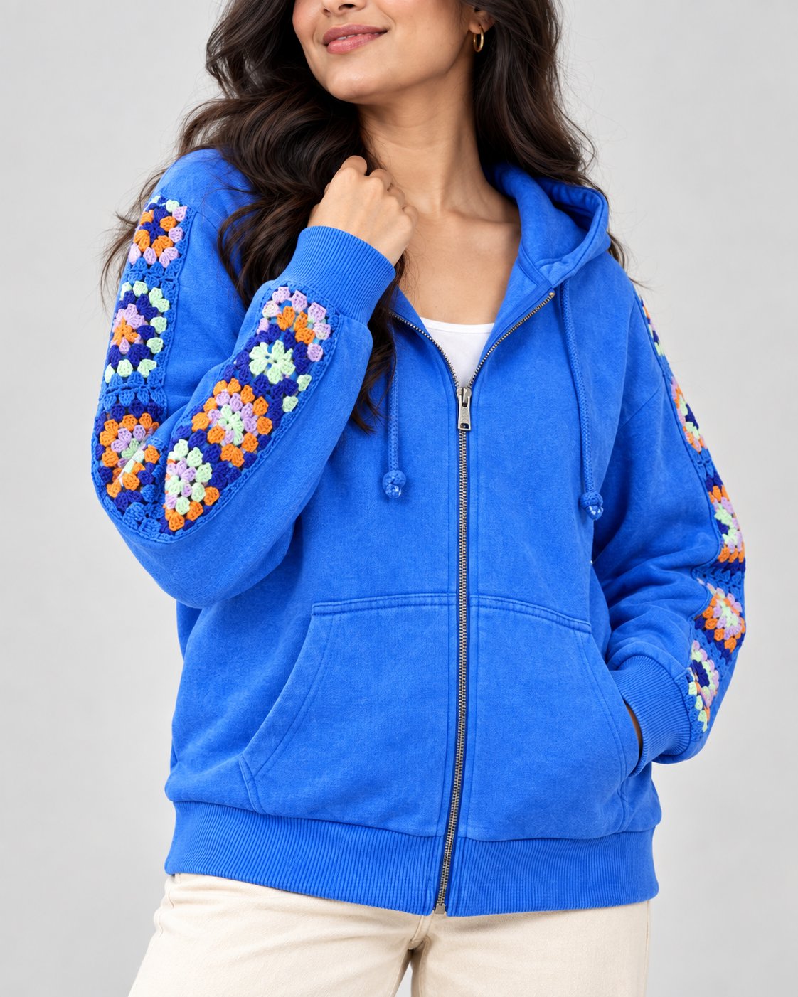 Cobalt stonewashed zip hoodie with orange and lilac hand-crocheted granny square sleeves