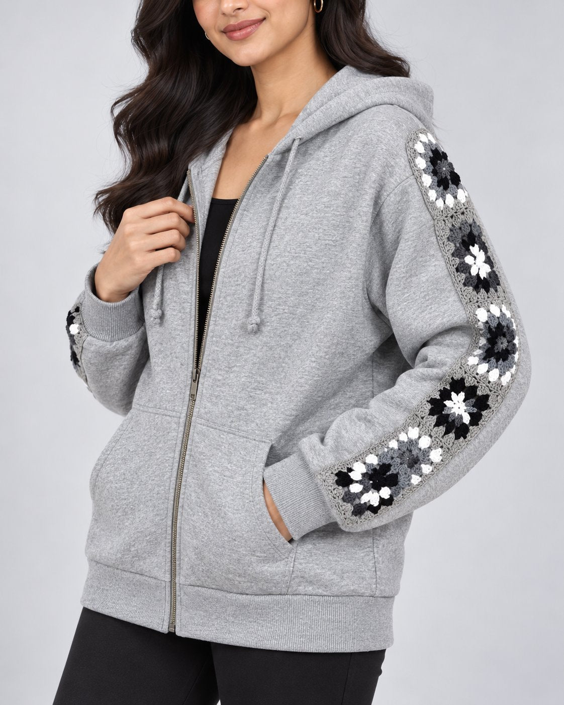 Grey melange zip hoodie with black and white hand-crocheted granny square sleeve panels