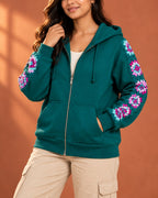 Teal cotton fleece zip hoodie with hand-crocheted granny square panels down the sleeves